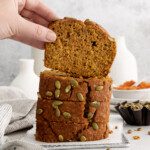 hand holding a slice of pumpkin spice latte bread