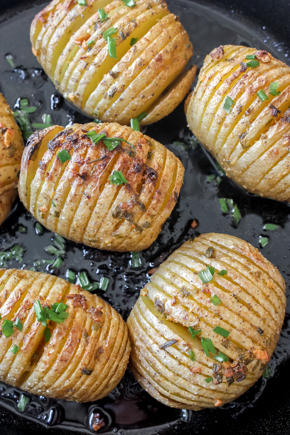 Hasselback Potato Skillet with Mustard Garlic Butter + Chives