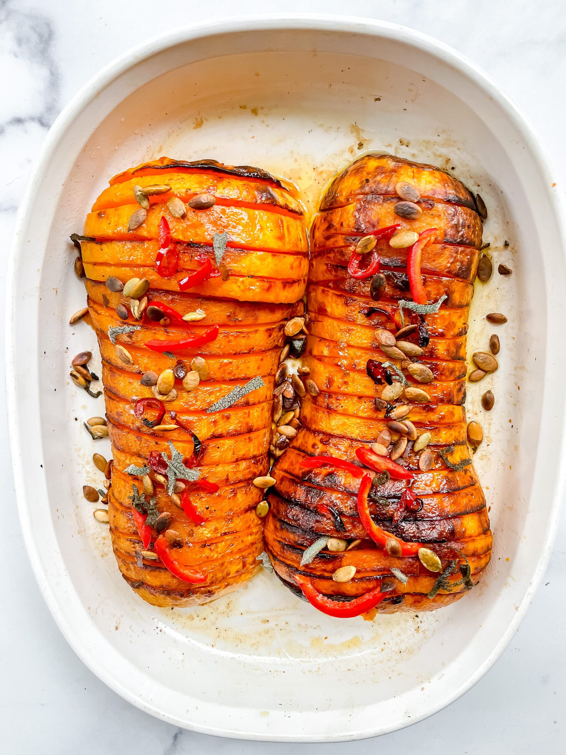 Hasselback Butternut Squash with Maple Sage Butter, Red Chile, + Pumpkin Seeds                   (Vegan, Gluten Free)
