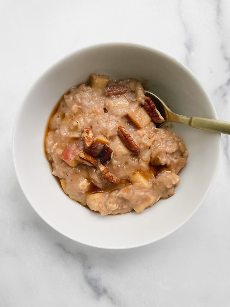 a-bowl-of-kathleen-ashmores-slow-cooker-apple-pie-oatmeal-topped-with-chopped-pecans-the-perfect-back-to-school-breakfast