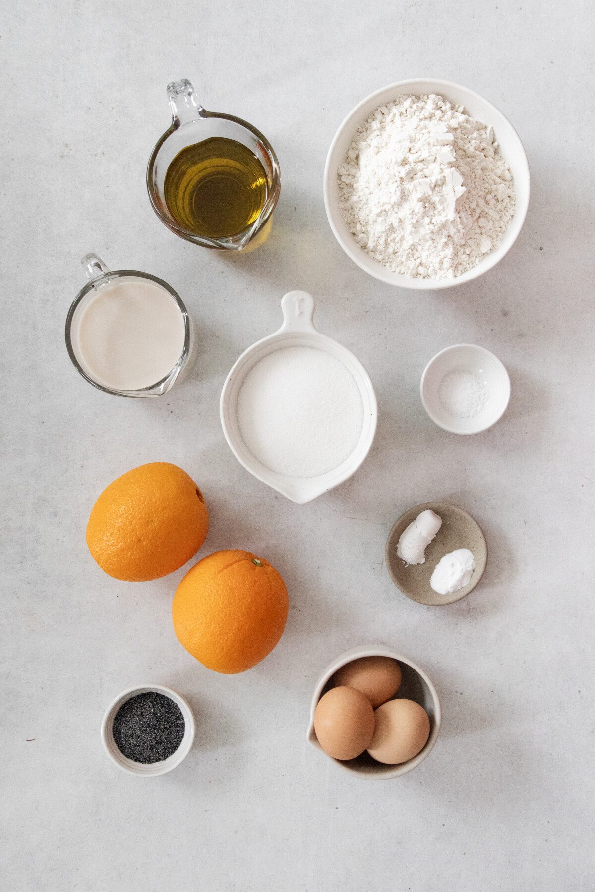 ingredients in ceramic bowls: eggs, oil, flour, salt, sugar